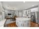 Large kitchen with a center island and an adjacent seating area at 9627 Baileywick Rd, Charlotte, NC 28277