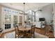 Bright living room with vaulted ceiling, fireplace, and large windows for natural light at 9627 Baileywick Rd, Charlotte, NC 28277