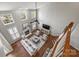 Airy living room with hardwood floors, fireplace, multiple windows, and neutral color scheme at 9627 Baileywick Rd, Charlotte, NC 28277