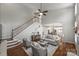 Bright living room boasts hardwood floors, neutral paint, and an open floor plan adjacent to the kitchen at 9627 Baileywick Rd, Charlotte, NC 28277