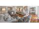Comfortable living room with hardwood floors and staircase at 9627 Baileywick Rd, Charlotte, NC 28277