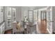 Well-lit home office with modern desk, plantation shutters and french doors at 9627 Baileywick Rd, Charlotte, NC 28277