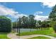 Community tennis court with a well-maintained surface and secure fencing at 9627 Baileywick Rd, Charlotte, NC 28277