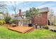 Expansive wooden deck perfect for outdoor entertaining, overlooking the well-maintained backyard at 9800 Deer Brook Ln, Charlotte, NC 28210