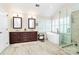 Luxurious bathroom featuring soaking tub, glass shower, and double vanity at 9800 Deer Brook Ln, Charlotte, NC 28210