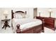 Primary bedroom features a large bed, dresser, and natural light at 9800 Deer Brook Ln, Charlotte, NC 28210