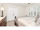 Comfortable bedroom with natural light, a dresser, and closet at 9800 Deer Brook Ln, Charlotte, NC 28210