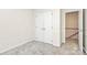 Neutral bedroom with carpeted floor, closet, and view to upstairs hallway at 9800 Deer Brook Ln, Charlotte, NC 28210