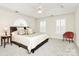 Bedroom with neutral walls, shutters on windows, and ceiling fan at 9800 Deer Brook Ln, Charlotte, NC 28210