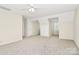 Large bonus room with neutral walls and carpeted floors at 9800 Deer Brook Ln, Charlotte, NC 28210