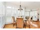 Bright breakfast nook with large windows, plantation shutters and stylish light fixture at 9800 Deer Brook Ln, Charlotte, NC 28210