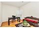 Bright home office with hardwood floors and natural light at 9800 Deer Brook Ln, Charlotte, NC 28210