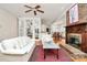Inviting living room with a classic fireplace, built-in display, and open floor plan at 9800 Deer Brook Ln, Charlotte, NC 28210