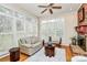 Comfortable living room with large windows, shutters, and a cozy seating area at 9800 Deer Brook Ln, Charlotte, NC 28210