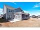 Exterior of home with spacious backyard and screened in porch at 982 Old Trace Nw Rd, Concord, NC 28027