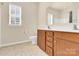 Bathroom showcasing granite countertop vanity, toilet, and shower with window at 982 Old Trace Nw Rd, Concord, NC 28027
