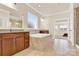 Bright bathroom features a large soaking tub, double vanity, and separate glass shower at 982 Old Trace Nw Rd, Concord, NC 28027