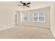 Bedroom featuring neutral carpet, a ceiling fan, and natural light from two windows at 982 Old Trace Nw Rd, Concord, NC 28027