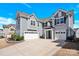 Two-story home featuring a three-car garage and lush landscaping at 982 Old Trace Nw Rd, Concord, NC 28027