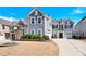 Two-story home featuring a well-manicured lawn and an attached two-car garage at 982 Old Trace Nw Rd, Concord, NC 28027