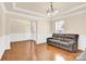Inviting living room with hardwood floors and a comfortable sofa at 982 Old Trace Nw Rd, Concord, NC 28027
