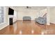 Open living room with hardwood floors, fireplace, and ample natural light at 982 Old Trace Nw Rd, Concord, NC 28027