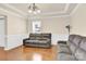 Comfortable living room featuring plush seating, hardwood floors, and elegant trim at 982 Old Trace Nw Rd, Concord, NC 28027