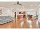 Open concept living space with hardwood floors and seamless access to the kitchen at 982 Old Trace Nw Rd, Concord, NC 28027