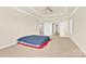 Primary bedroom boasts neutral carpet, ceiling fan, and an entrance doorway at 982 Old Trace Nw Rd, Concord, NC 28027