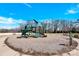 Community playground area with slide, climbing features and swings at 982 Old Trace Nw Rd, Concord, NC 28027