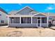 View of the back of the home with a screened in porch at 982 Old Trace Nw Rd, Concord, NC 28027