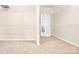 Walk-in closet with carpet flooring and multiple shelves and hanging rods for ample storage at 982 Old Trace Nw Rd, Concord, NC 28027