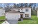 Charming two-story home featuring a two car garage and inviting front yard at 9928 Manor Vista Trl, Kannapolis, NC 28027