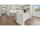 Modern kitchen with white cabinets, ample counter space, a center island, and stainless steel appliances at 9932 Manor Vista Trl, Kannapolis, NC 28027