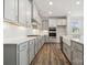 Modern kitchen with stainless steel appliances, gray cabinets, ample countertop space, and a center island at 9932 Manor Vista Trl, Kannapolis, NC 28027
