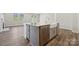 Kitchen island featuring a sink, dishwasher, and cabinet storage at 9932 Manor Vista Trl, Kannapolis, NC 28027