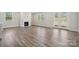 Spacious living room with a fireplace, recessed lighting, and access to the outside through French doors at 9932 Manor Vista Trl, Kannapolis, NC 28027