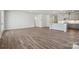 Large, open living space connecting the kitchen and additional living area at 9932 Manor Vista Trl, Kannapolis, NC 28027