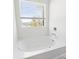 Bright bathroom featuring a soaking tub next to a window offering natural light at 1036 Bramcote Ln, Charlotte, NC 28215