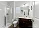 Well-lit bathroom featuring glass shower, vanity with sink, and modern fixtures at 1036 Bramcote Ln, Charlotte, NC 28215