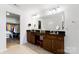 Dual sink bathroom with expansive countertop and vanity provides comfort and convenience at 1036 Bramcote Ln, Charlotte, NC 28215