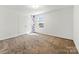 This bedroom features neutral carpet flooring and white walls with purple accents at 1036 Bramcote Ln, Charlotte, NC 28215