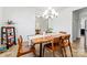 Charming dining area with modern chandelier, setting the stage for memorable meals at 1036 Bramcote Ln, Charlotte, NC 28215