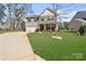 Charming two-story home featuring a well-manicured lawn and inviting curb appeal in a desirable neighborhood at 1036 Bramcote Ln, Charlotte, NC 28215