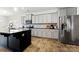 Modern kitchen featuring stainless steel appliances, granite countertops, and ample cabinet space at 1036 Bramcote Ln, Charlotte, NC 28215