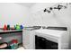 Bright laundry room features updated appliances and ample space for storage at 1036 Bramcote Ln, Charlotte, NC 28215