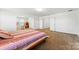 Spacious main bedroom showcases a comfortable layout with large windows and neutral carpet at 1036 Bramcote Ln, Charlotte, NC 28215