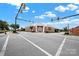 Street view of historic building at a crossroads with traffic lights at 105 S York St, Lancaster, SC 29720
