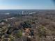 Aerial view of the home in a neighborhood of trees, close to the highway at 107 Doris Ct, Lincolnton, NC 28092