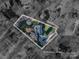 Aerial view showcasing the property's layout, landscaping, and approximate lot lines within a wooded area at 107 Doris Ct, Lincolnton, NC 28092